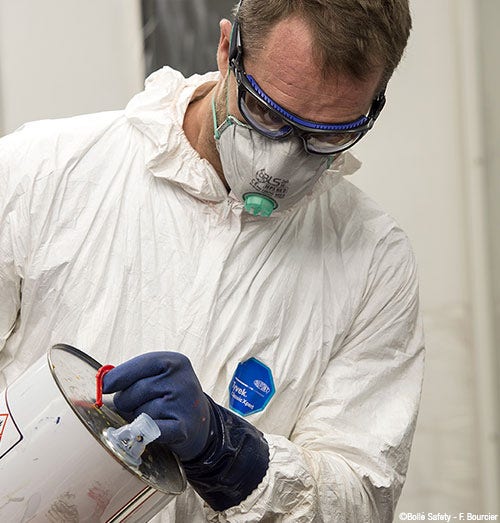 Man wearing glasses and safety costume